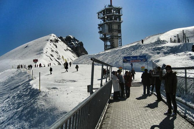 Alpine Majesty:Exclusive Private Tour to Mount Titlis from Luzern - Riding the gondolas toward Mt. Titlis
