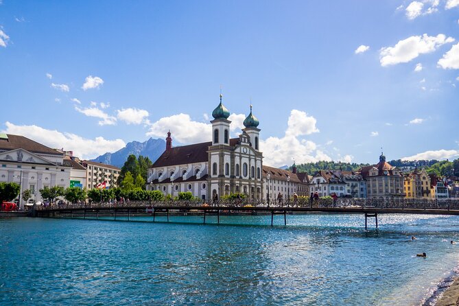 Explore Lucerne in 60 minutes with a Local - Crossing Spreuerbrücke and its painted roof