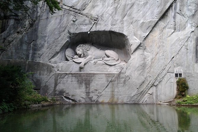 Lucerne Half-Day Small Group Walking Tour incl. Lake Cruise - Hotel des Balances and Schwanenplatz: facades and city life