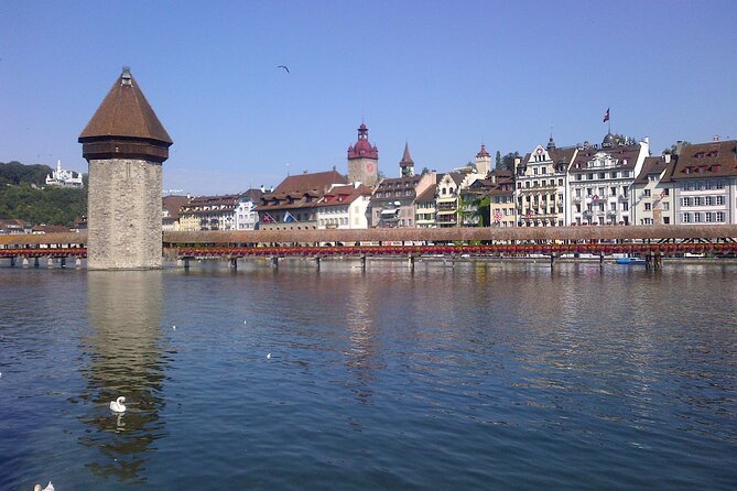 Luzern Elegance: Private City Walk and Panoramic Lake Cruise - Kornmarkt and Hotel des Balances bring on the grand facades