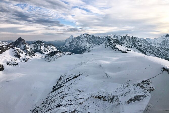 Matterhorn helicopter tour - longest scenic flight from Bern over the Swiss Alps - Oeschinensee brings color to the route