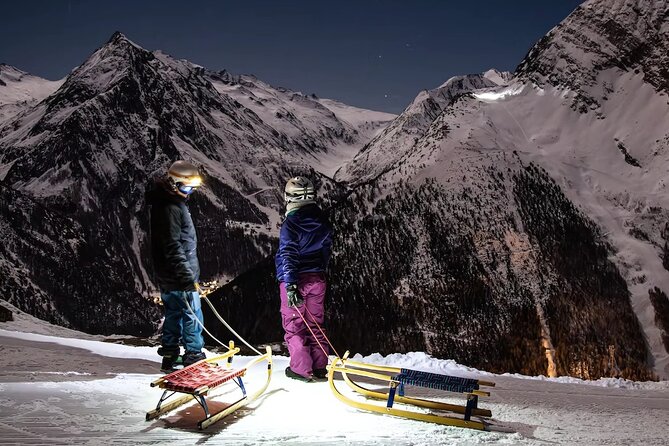 Night Sledding and Fondue Feast Interlaken - Riding the 5-kilometer sled route after dark