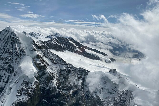 Private Swiss Alps helicopter tour over snow covered mountain peaks and glaciers - The Schilthorn and its James Bond connection