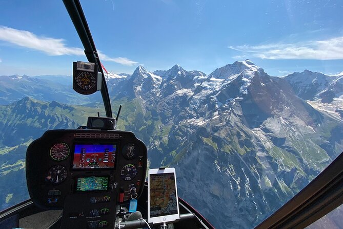 Private Swiss Alps helicopter tour over snow covered mountain peaks and glaciers - Lake Thun and Lake Brienz from the air