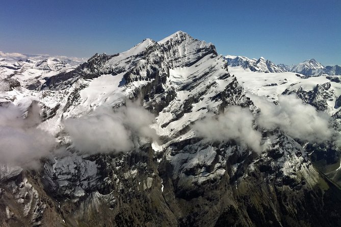 Private Swiss Alps helicopter tour over snow covered mountain peaks and glaciers - What the private format adds