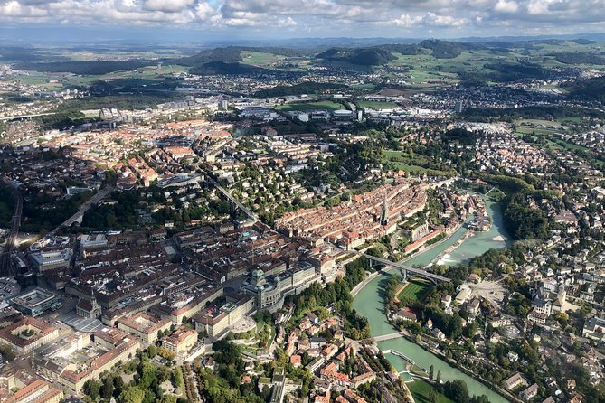 Swiss Capital city helicopter sightseeing tour - the ideal flight to see Berne - The Parliament building and Bern Münster from above